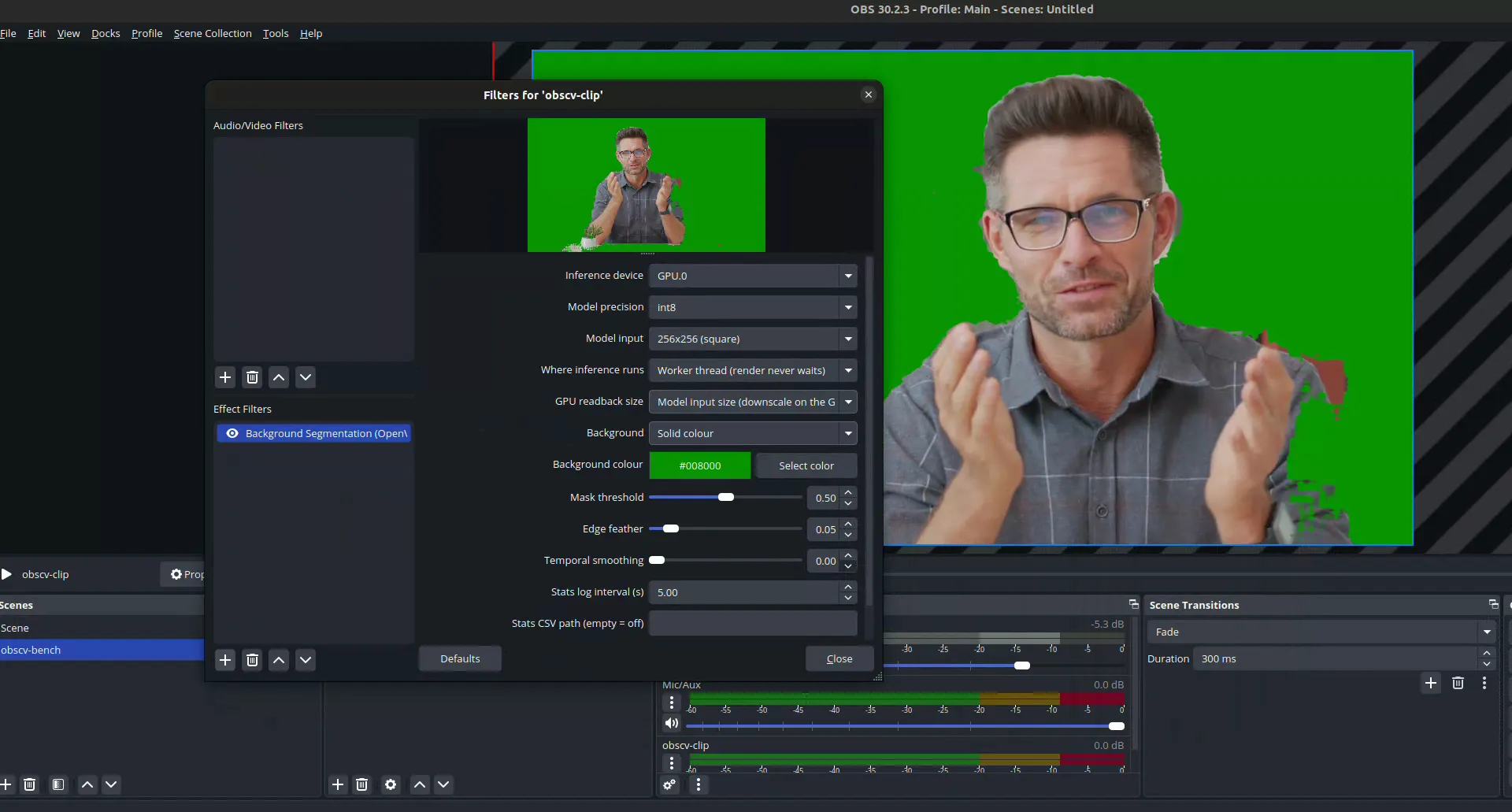 The filter's properties panel in OBS with the clip's background replaced by green: inference device, model precision and input, threading mode, readback size, background colour, and the threshold, feather and smoothing sliders